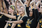While in "block I" formation, student leaders give a cheer for Iowa.