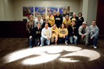 A group from the UI Alumni Association bowl trip poses by a Tigerhawk light on the way to the Hawkeye Huddle on the eve of the Insight Bowl. Those in attendance enjoyed cash refreshments and concessions, special guest speakers, video highlights, the Hawkeye Marching Band, cheerleaders, dance team, and Herky.