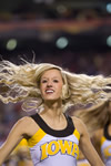 A UI cheerleader dances during halftime at the Insight Bowl. 