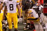 Junior quarterback James Vandenberg sits on the bench in the final minutes of the game. Although the Iowa offense outgained Oklahoma, 292-275 — with Vandenberg completing 23 of 44 passes for 216 yards and two touchdowns — the yardage advantage was not enough to help Iowa win the game.
