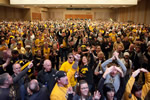 The crowd welcomes parents of the UI football team to the stage at the Hawkeye Huddle, an event hosted by the National I-Club and the UI Alumni at the Phoenix Convention Center South Ballroom in downtown Phoenix.