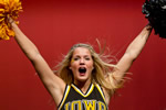 A UI cheerleader dances at the pep rally portion of the Hawkeye Huddle.