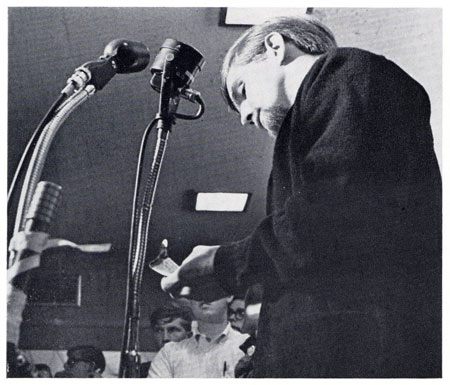 Steve Smith burns his draft card during “Soapbox Sound Off” in the Iowa Memorial Union, Oct. 20, 1965 