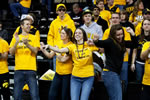 Iowa fans celebrate the men’s basketball team’s 75-59 victory over 13th-ranked Michigan on Jan. 14.