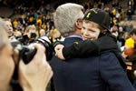 Iowa men’s basketball coach Fran McCaffery gets a celebratory hug from one of his sons after the Hawkeyes defeated 20th-ranked Indiana 78-66 on Feb. 19.