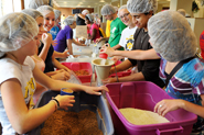 Student volunteers packaged emergency meals for distribution across the country and abroad—combined with water, the contents of each bag feed six to eight people.