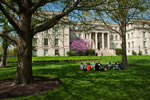 A class takes advantage of temperatures in the 70s and gathers outdoors near Schaeffer Hall.