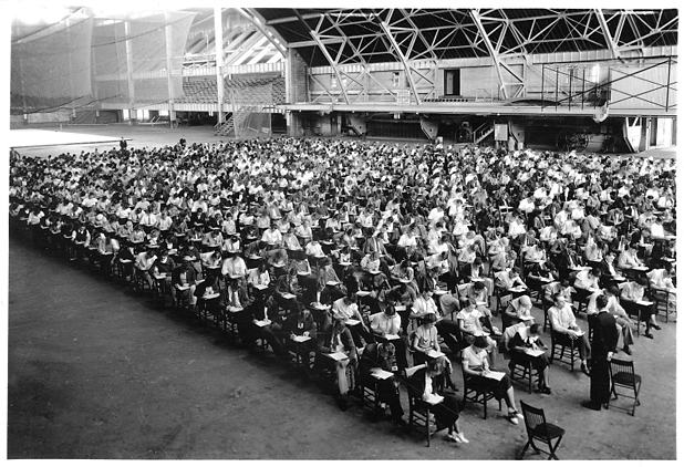Students taking exam in Field House during Freshman Week, 1930s