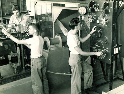 Adjusting levers and dials in the hydraulics laboratory, Aug. 15, 1948. 
