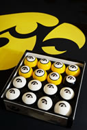 These black and gold Hawkeye billiard balls have numbers on the back.